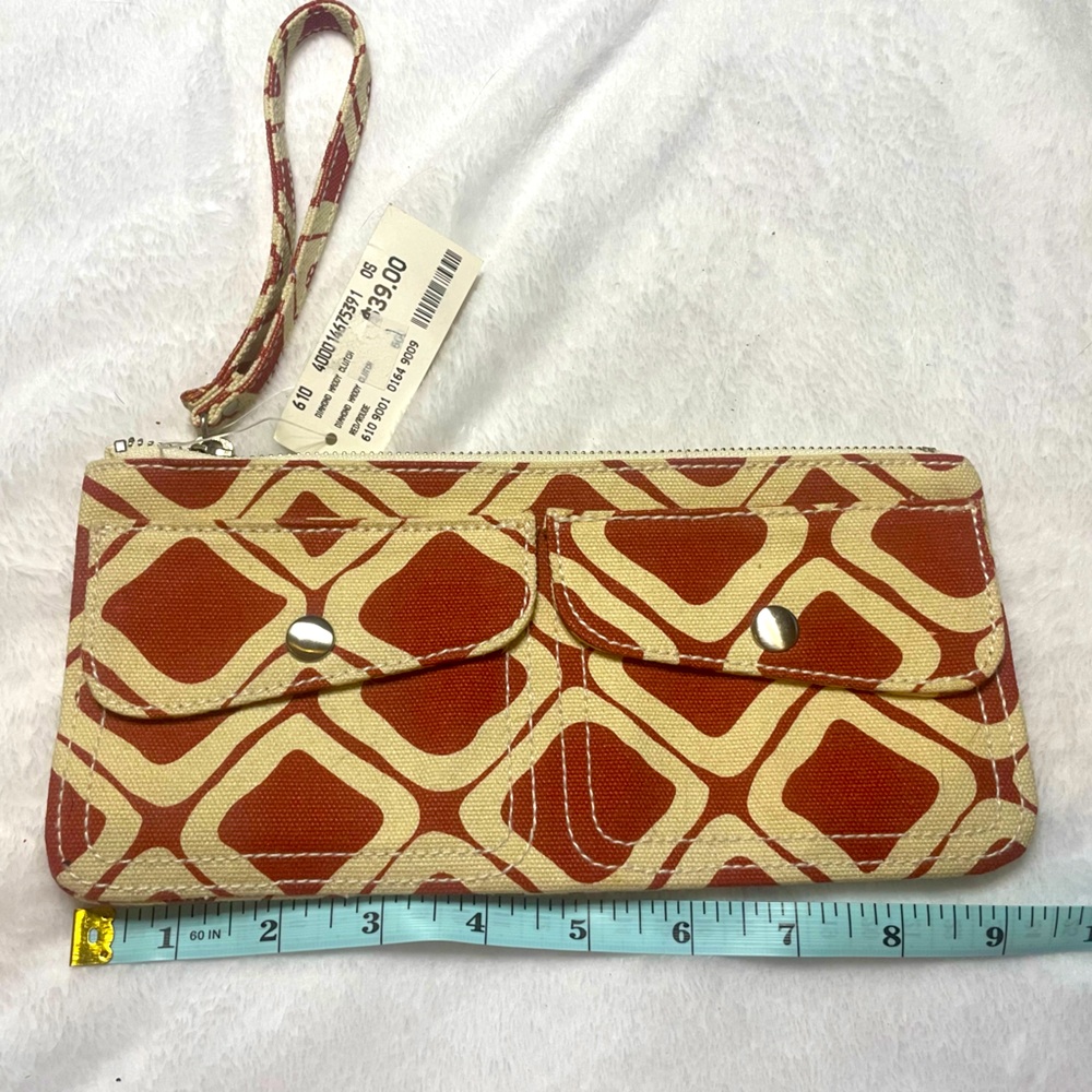 Club Monaco wristlet - reddish Orange and cream